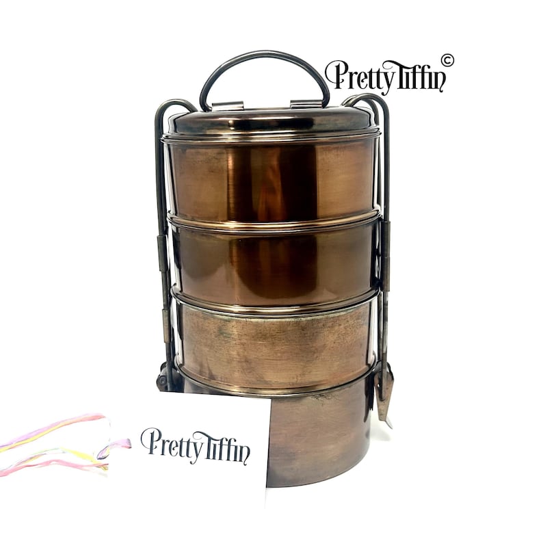 Bronze tiffin lunchbox 
Antique tiffin box 
stainless steel lunchbox