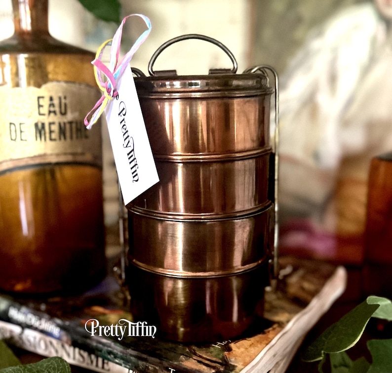 Beautiful tiffin lunchbox. 
metal tiffin box. 
lunch dabba. 
compartment lunchbox 
South Asian Lunch Tin