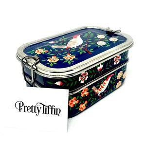 a beautiful hand painted lunchbox with two compartments and easy to open clasps
