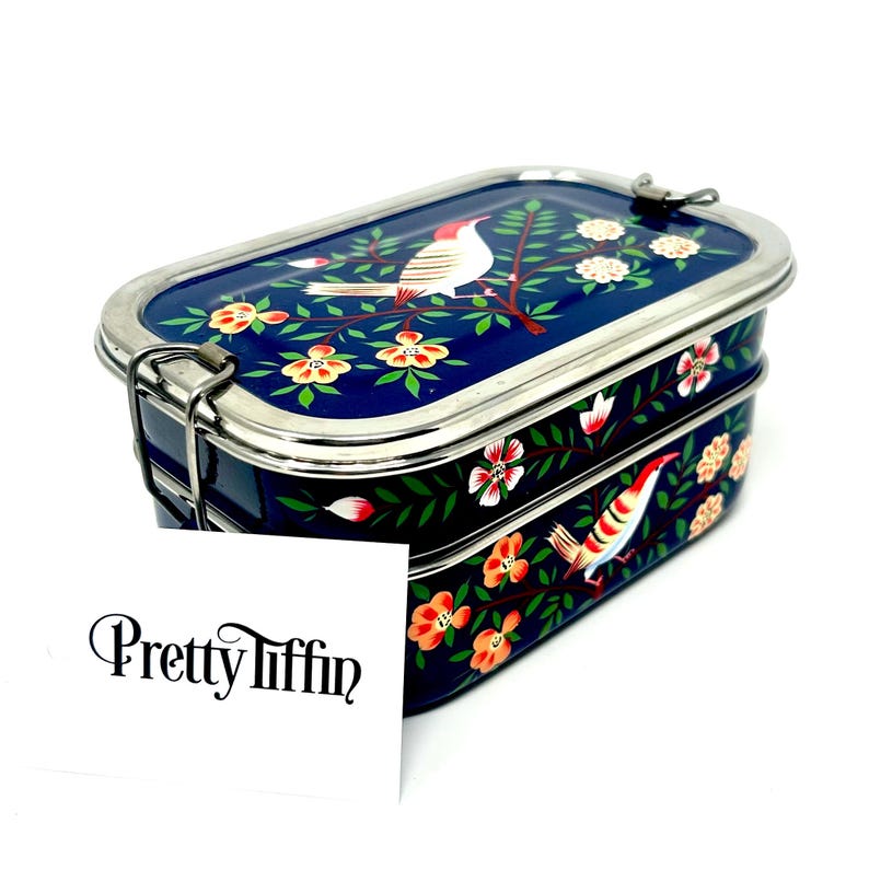 a beautiful hand painted lunchbox with two compartments and easy to open clasps