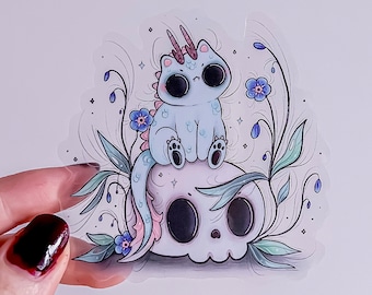 Dragon Kitty Bluemer on Skull with Forget me not Flowers transparent Sticker