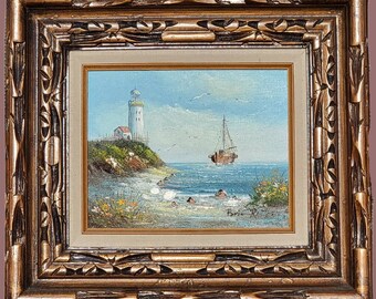 New England Coast Painting. Lighthouse with ship at sea vintage framed artwork.