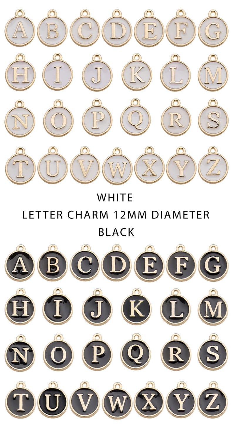 May include: A collection of gold-toned letter charms, each 12mm in diameter, with white and black enamel backgrounds. The letters A through Z are displayed in both color variations. The charms are round with a loop at the top for attaching to jewelry.