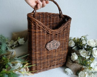 Woven hanging basket for the entryway in rustic style,brown color,perfect for decorating walls or doors in the house. Winter & Holiday Decor
