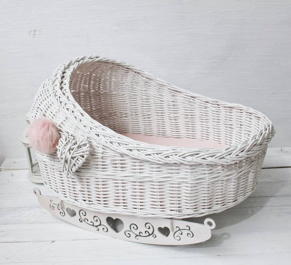 pink and white bassinet