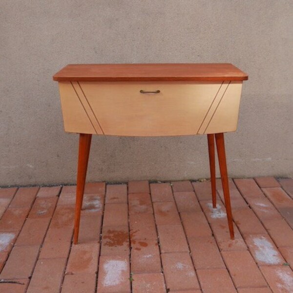 Vintage sideboard with pastel yellow front