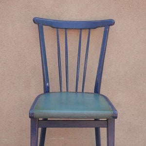 Old rung chair With green seat