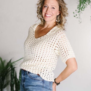 May include: A set of three ceramic mugs with a speckled, matte finish. The mugs are in shades of cream, light gray, and dark gray. Each mug has a simple, minimalist design, perfect for coffee or tea.