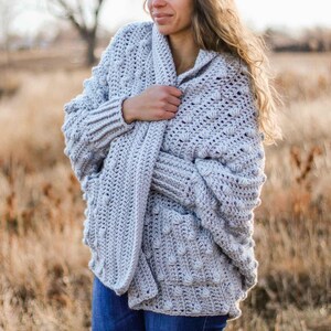 A beginner rectangle cardigan worn by a woman.