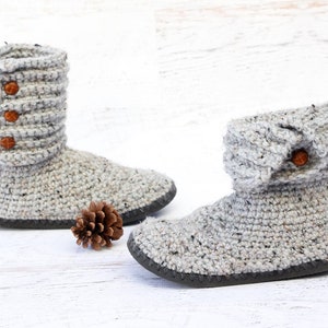 A pair of gray cozy ugg style boots.