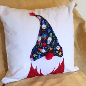 Gnomes with a hat with gnomes, bright blue, red body. handmade pillow on white canvas.   16” square  removable cover  zipper closure.