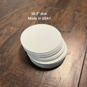 May include: A stack of 50 white, 3-inch round paper discs.  Made in USA!!
