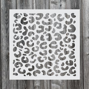 May include: White stencil with a leopard print design. The stencil is made of a thin, flexible material and is perfect for creating a variety of crafts.