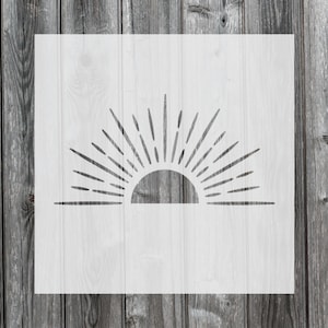 May include: A white stencil of a sun with rays, perfect for crafting and DIY projects.