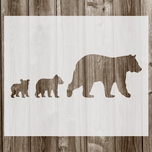 May include: A white silhouette of a bear family walking in a line, with a large bear in the front, a medium-sized bear in the middle, and a small bear in the back.