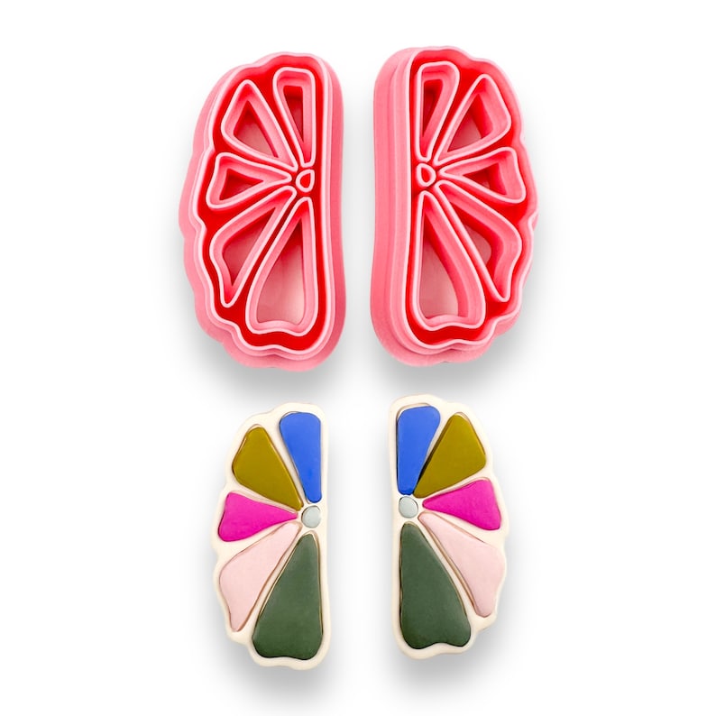 May include: Two pairs of earrings, one pair is pink and the other is multi-colored. The pink pair is a simple flower shape, while the multi-colored pair is a more intricate design with pink, blue, green, and gold accents.