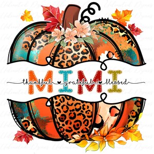 May include: A colorful pumpkin with a leopard print design and the word "MIMI" written on it. The pumpkin is surrounded by fall leaves and flowers. The text "thankful grateful blessed" is written below the pumpkin.