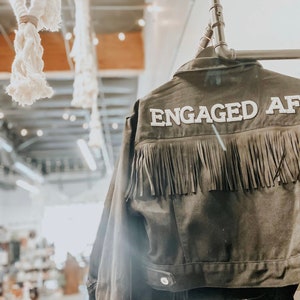 black fringe jacket personalized with Engaged AF on back