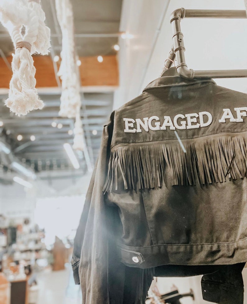 black fringe jacket personalized with Engaged AF on back