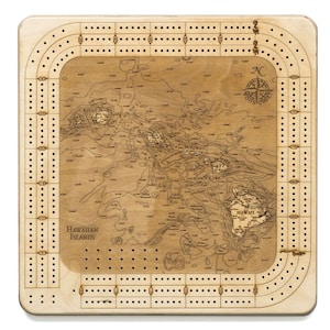 May include: A wooden cribbage board with a map of the Hawaiian Islands. The board has a compass in the upper right corner and the words "Hawaiian Islands" in the lower left corner.