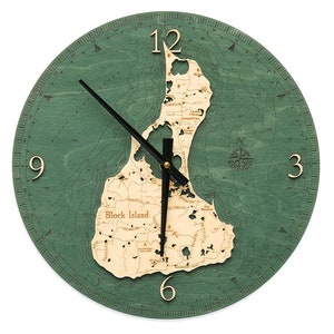 May include: A green wooden clock with a map of Block Island, Rhode Island. The clock face is surrounded by a nautical compass and depth markings. The clock hands are black and gold.