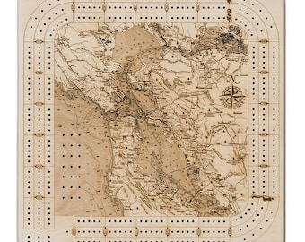 May include: A wooden cribbage board with a map of the San Francisco Bay Area engraved on the surface. The board has a compass rose and the words "GO" and "N" printed on it.