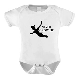 May include: White baby grow with a black silhouette of Peter Pan flying and the text "NEVER GROW UP".