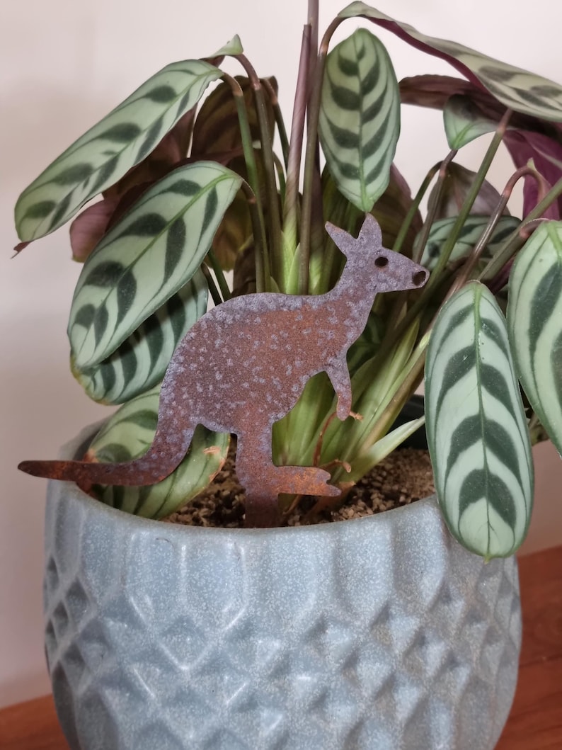 Miniature Australian-made corten (rusty) kangaroo pot plant stake.
