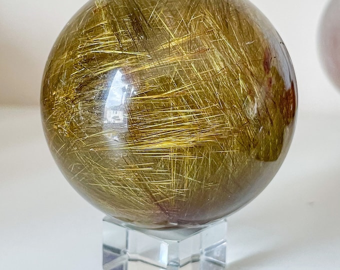 Finest Golden Rutilated Quartz sphere - luxury Crystal for Home decor and manifestation
