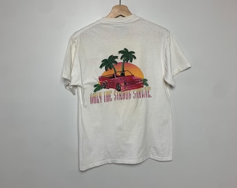 1990 年代「強い者だけが生き残る」カー T シャツ
