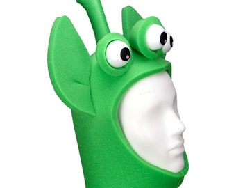 May include: Green foam alien costume with large googly eyes and a long antenna. The costume has a head opening for wearing.