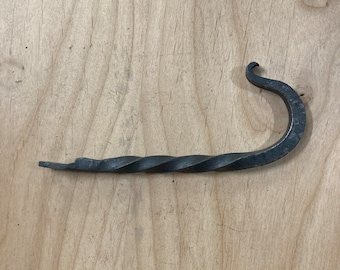 Hand forged hook with a twist