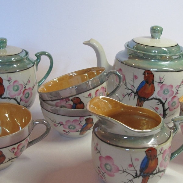 Trico Nagoya, green, white and orange glossy tea service decorated with red and blue birds and hand-painted flowers, Japan circa 1950