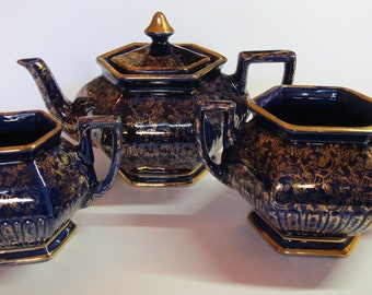 Arthur Wood Quality, cobalt blue teapot, creamer and sugar bowl (4279), England circa 1954