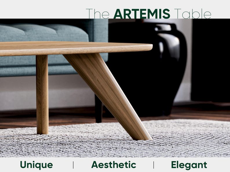 May include: The Artemis Table, a modern wooden coffee table with a light wood finish. The table features a unique angled leg design and is set on a gray rug. The text at the top reads "The ARTEMIS Table". Below the table are the words "Unique | Aesthetic | Elegant".