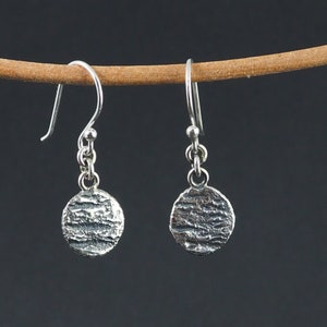 Silver earrings with burnt surface