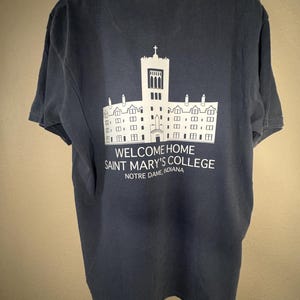 Saint Mary’s College Comfort Colors T-Shirt | Le Mans Hall Back Design | French Cross Front | Welcome Home Belle Shirt | Denim Blue Tee