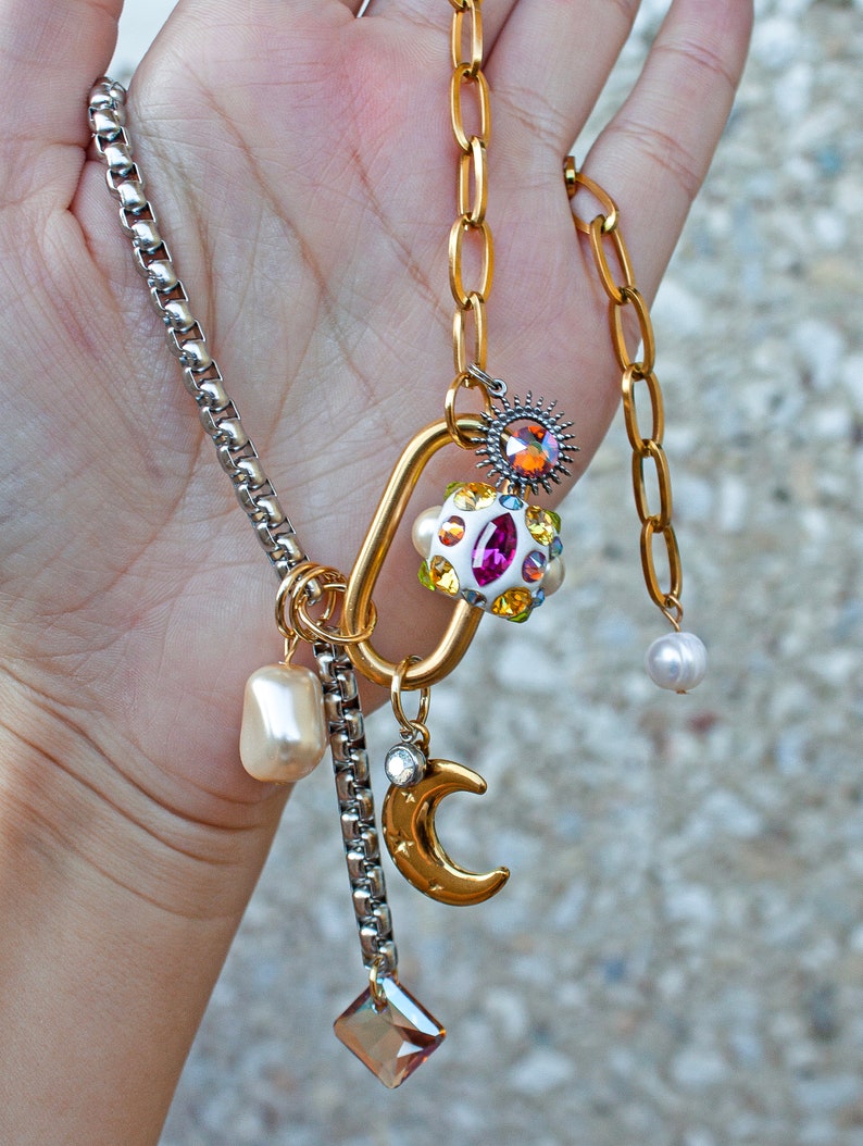 Half Tone Stainless Steel Choker necklace with gold carabiner lock. Carabiner Lock is hand decorated with Swarovski crystals, which are set in white Ceralun clay. This necklace has an adjustable length and it comes with celestial gold moon charm.