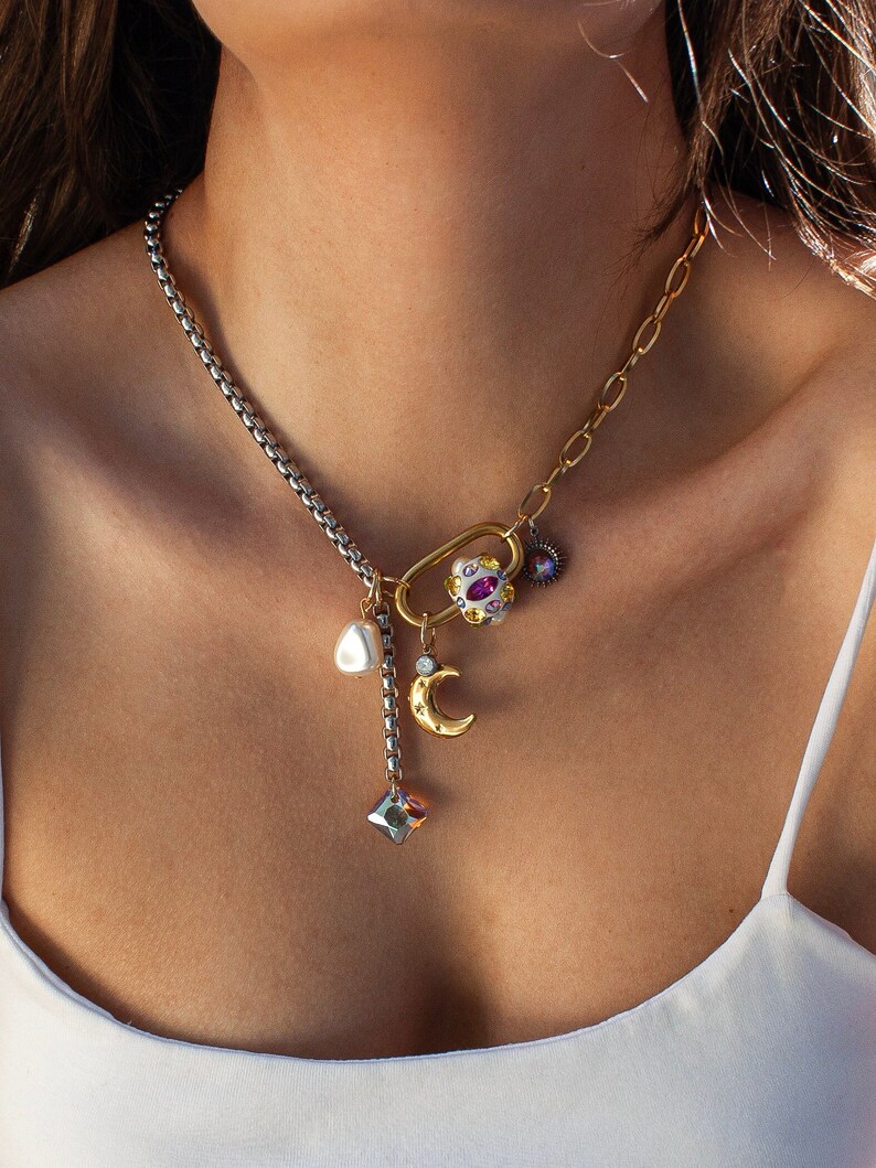 Half Tone Stainless Steel Choker necklace with gold carabiner lock. Carabiner Lock is hand decorated with Swarovski crystals, which are set in white Ceralun clay. This necklace has an adjustable length and it comes with celestial gold moon charm.