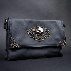 Gothic black bag with a silver skull centrepiece and rose detailing by CHOK GothX.