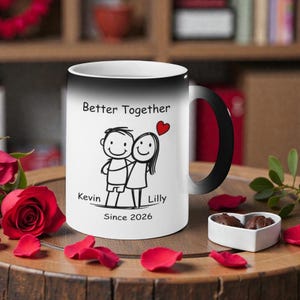 May include: White ceramic mug with a black handle and rim, featuring the text "Better Together" and stick figures of a couple with a red heart. The names "Kevin" and "Lilly" are below the figures, with "Since 2026" below.