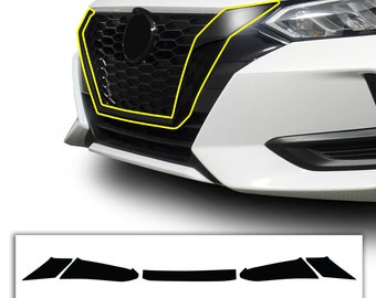 May include: A set of black vinyl car decals for a front bumper. The decals are shaped like a triangle and a rectangle. The decals are designed to cover the front bumper of a car.