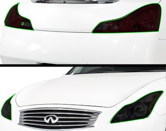 May include: A white car with tinted headlights and taillights. The car has a black grille with the Infiniti logo.