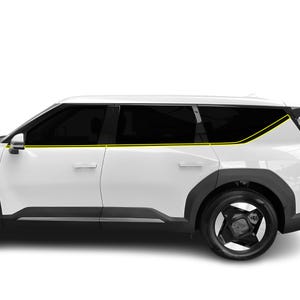 May include: White SUV with black tinted windows and black wheels. The car has a modern design with sharp lines and a sleek profile.