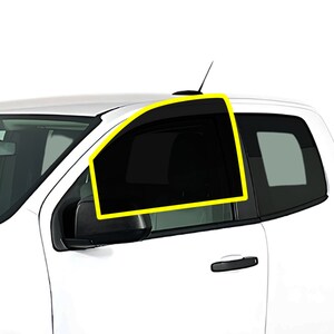 May include: A white pickup truck with a tinted window on the driver's side. The window is outlined in yellow.