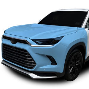 Puede incluir: Un coche azul claro con una parrilla y faros negros. El coche está cubierto con una película protectora.