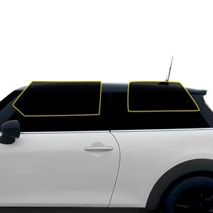 May include: A white car with tinted windows. The rear windows are partially covered with black window tint.