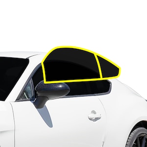 May include: A white car with tinted windows. The rear passenger window is partially rolled down. The car has a black side mirror.