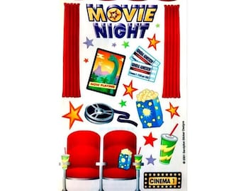 May include: A sticker sheet featuring a movie night theme with red curtains, two red theater seats, a film reel, popcorn, drinks, and tickets. The text reads MOVIE NIGHT, NOW PLAYING, GENERAL ADMISSION, and CINEMA 1. Colorful stars decorate the background.