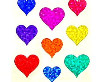 May include: A sheet of nine heart-shaped stickers in various colors including blue, magenta, pink, purple, yellow, orange, red, and teal. Each heart features a textured, glittery, or holographic finish that reflects light across the surface.